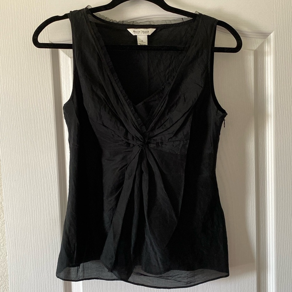 Sleeveless black blouse